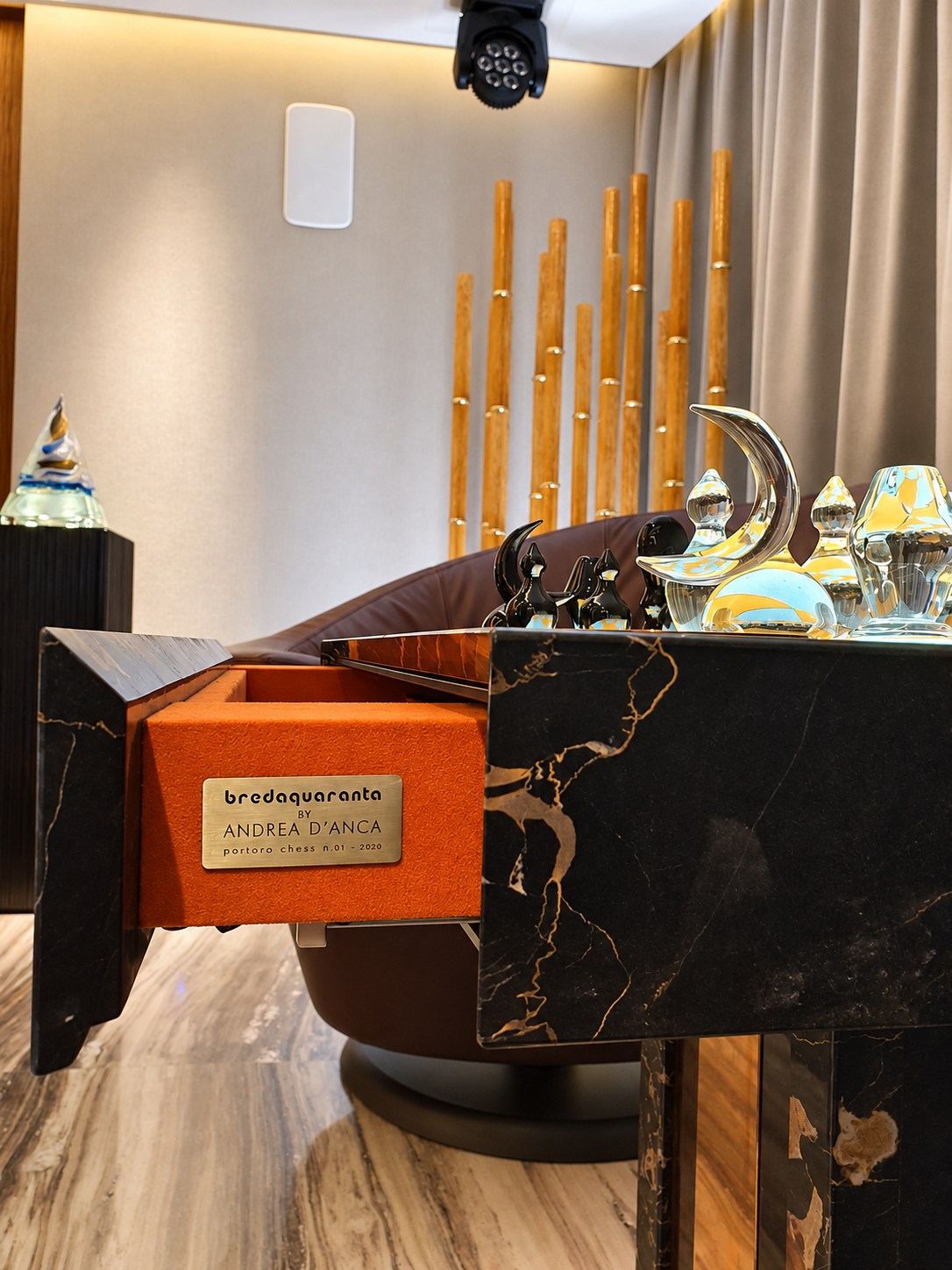 Portoro chess table with an orange-lined drawer and Andrea D’Anca signature plate.