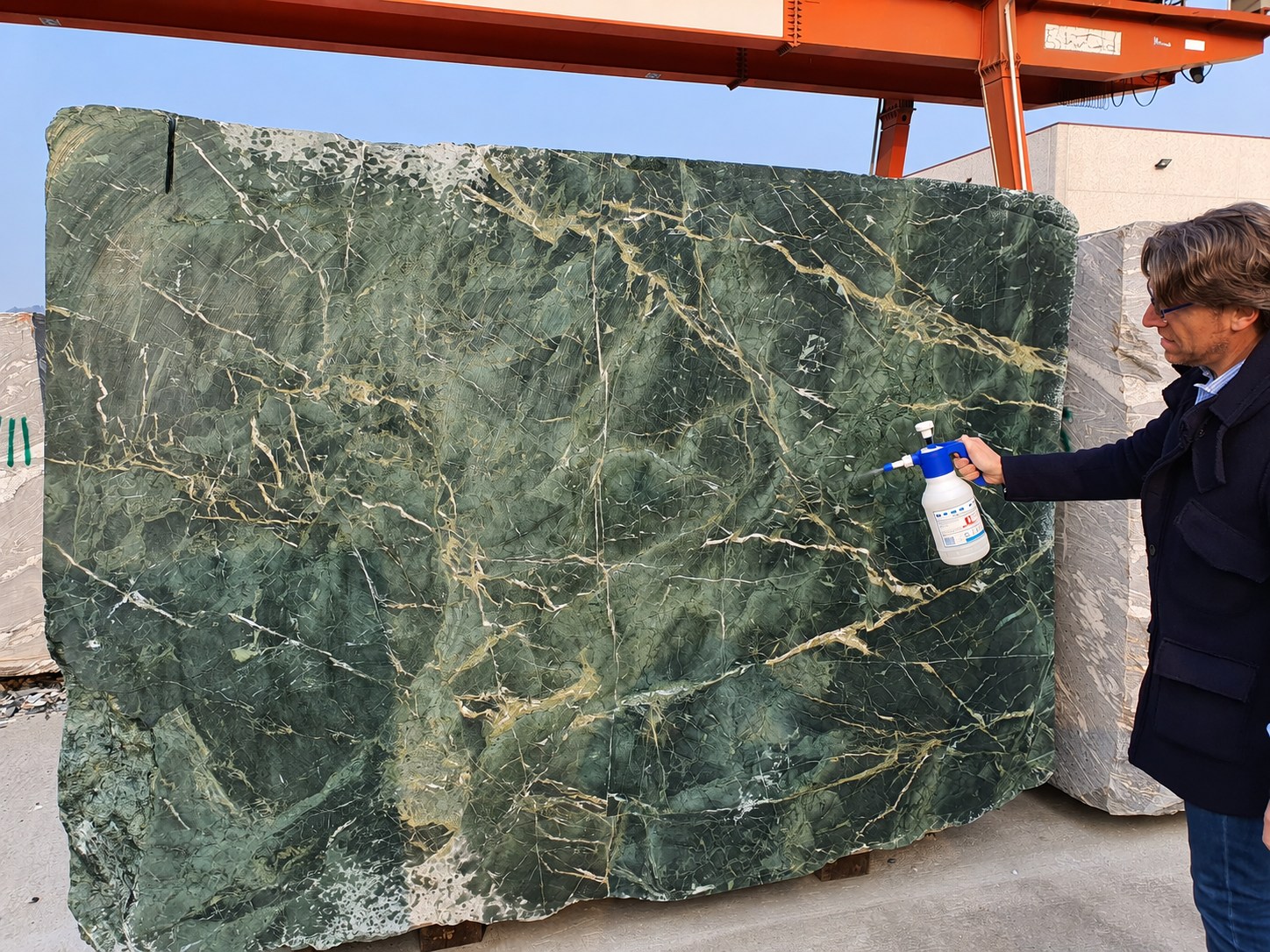 Natural stone slab examined at the supplier yard.